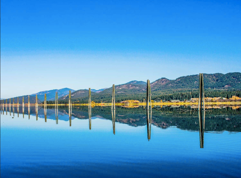 Pend Oreille River with old pilings and mountains